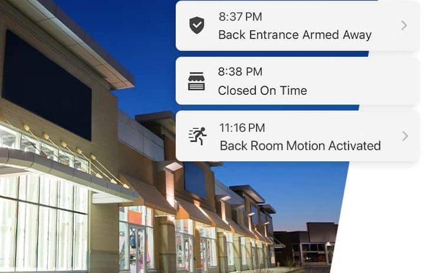 Storefront at night with alarm alerts for arming, closing, and motion