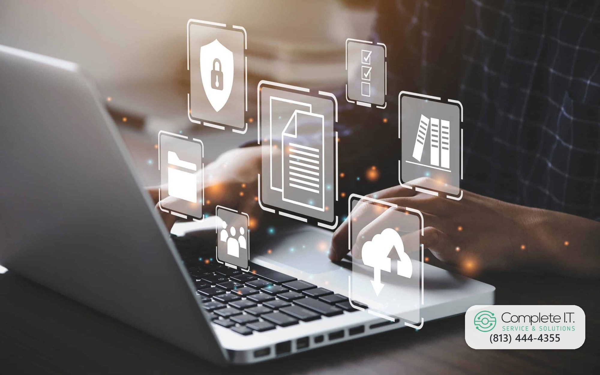 Laptop with floating icons for files, security, and cloud services