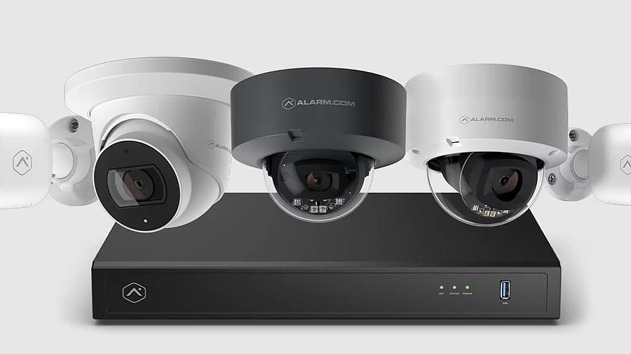 Three dome security cameras on top of a network video recorder